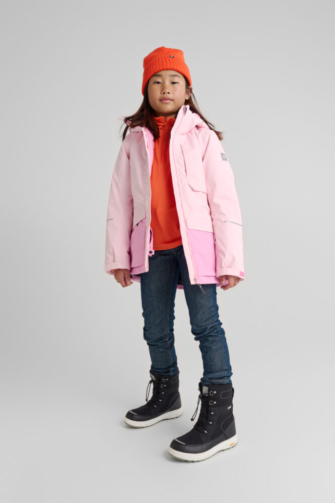 Girl wearing Reimatec ski jacket