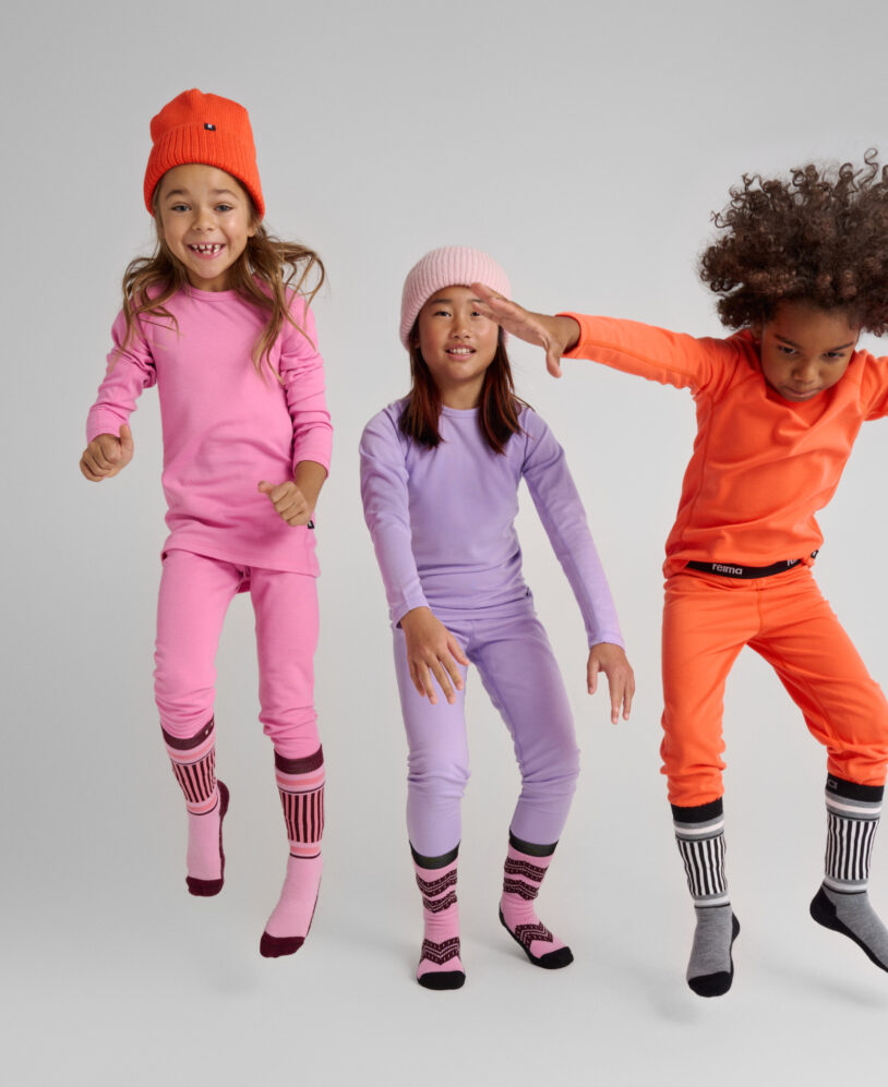 Image of three kids wearing Lani base layer sets